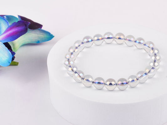 Angel Aura Quartz crystal, with vibrant iridescent colours, promoting high vibrations and energy.