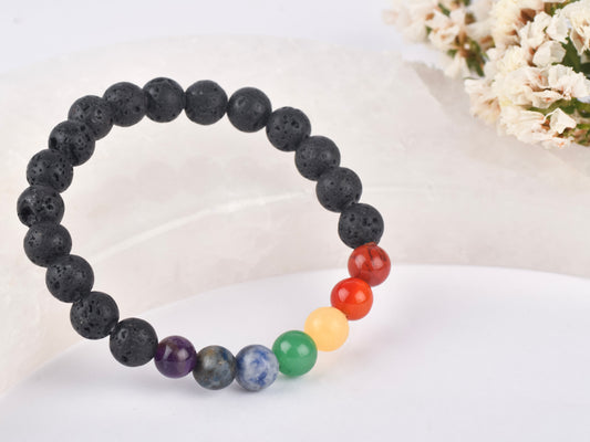 Lava stone with seven chakra beads for spiritual energy balance.