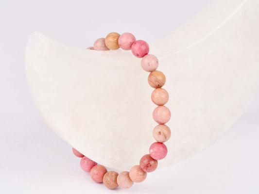 Rhodonite crystal stone for emotional healing and love energy.