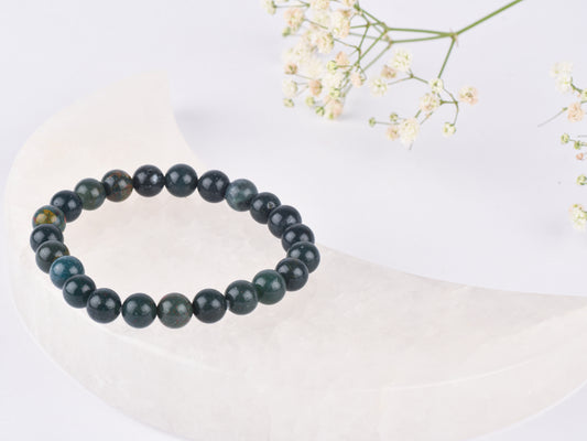 Bloodstone crystal stone promoting vitality, protection, and life force energy.